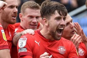 Callum Lang leads the celebrations after the opening goal