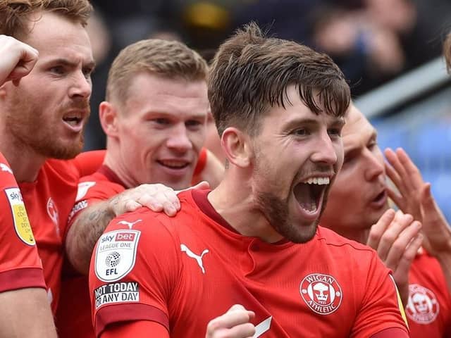 Callum Lang leads the celebrations after the opening goal