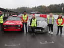 Galloway's staff next to Ford Escort MK2 and Aston Martin Vantage V8