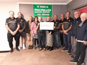 Joe Fitzsimmons presents a cheque to Mcamillan Cancer Support