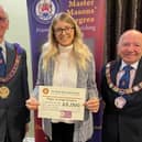 John Bicknell, Assistant Provincial Grand Master, with the hospice's fund-raising manager Sophie Cannon and Keith Beardmore, Provincial Grand Master