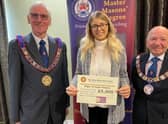 John Bicknell, Assistant Provincial Grand Master, with the hospice's fund-raising manager Sophie Cannon and Keith Beardmore, Provincial Grand Master
