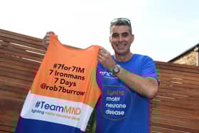 Martyn with the jersey he will be completing his challenge in