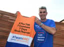 Martyn with the jersey he will be completing his challenge in