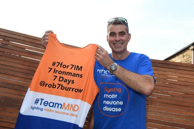 Martyn with the jersey he will be completing his challenge in