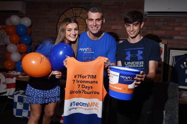 Martyn, centre with children Holly, left and Luke