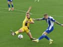 James McClean fires in a shot against Burton