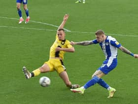James McClean fires in a shot against Burton