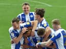 Jason Kerr enjoys the celebrations following Latics' second goal against Burton