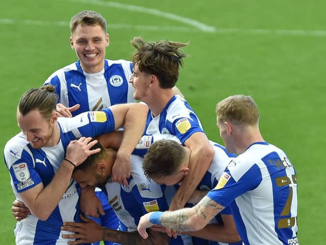 Jason Kerr enjoys the celebrations following Latics' second goal against Burton