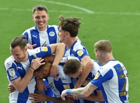 Jason Kerr enjoys the celebrations following Latics' second goal against Burton