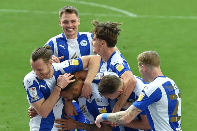 Jason Kerr enjoys the celebrations following Latics' second goal against Burton