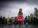 Little Amal walks through Wigan