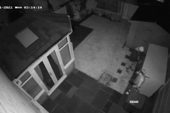 CCTV footage on Cambourne Drive which show two males breaking into a bike box