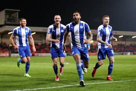 The Latics players celebrate Curtis Tilt's late winner at Fleetwood