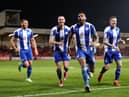 The Latics players celebrate Curtis Tilt's late winner at Fleetwood