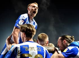 Jack Whatmough leads the celebrations at Fleetwood