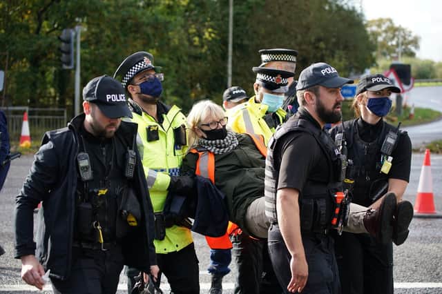 Police intervene at an Insulate Britain demonstration
