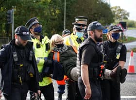 Police intervene at an Insulate Britain demonstration