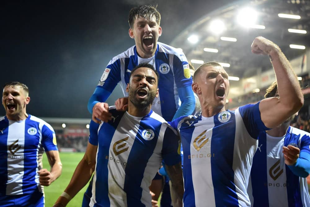 The Latics players celebrate their late heroics at Fleetwood in midweek