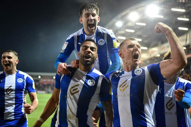 The Latics players celebrate their late heroics at Fleetwood in midweek