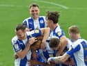 Curtis Tilt is mobbed after scoring against Burton last weekend