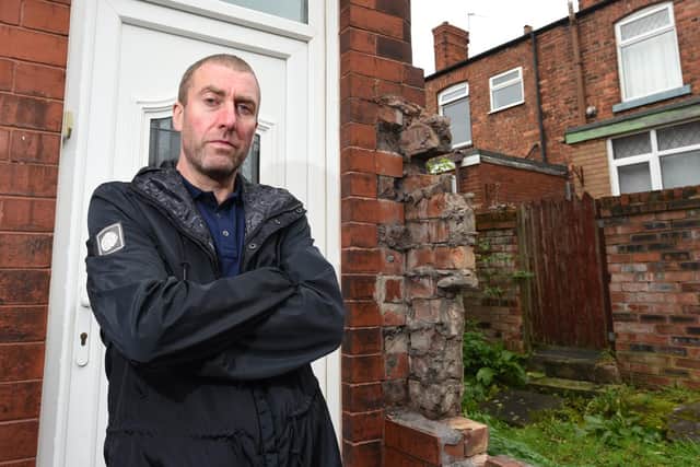Shaun Eccleston a resident of Whiteside Avenue, Springfield, who with partner Michelle Jones are angry after a wall has been removed leaving residents exposed.