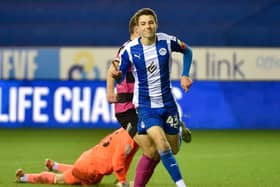 Chris Sze celebrates scoring against Shrewsbury
