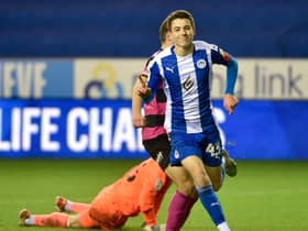 Chris Sze celebrates scoring against Shrewsbury