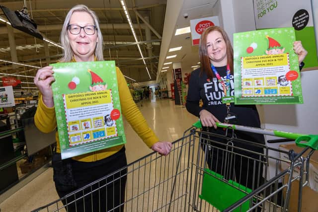 Maureen Holcroft, founder of Daffodils Dreams, with Rebecca Glaze, community champion at Asda in Wigan, as they launch the appeal