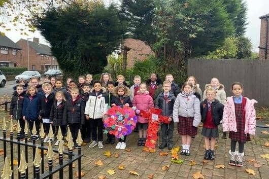 Holy Family pupils at Platt Bridge's war memorial