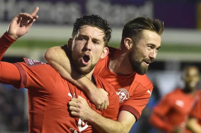 Callum Lang celebrates scoring the winner at Solihull