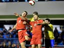 Kell Watts and Charlie Wyke compete for the ball at Solihull