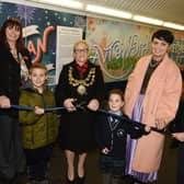 The official celebration of the new mural along the tunnel at Wigan North Western station, as local artist Jessica Riley worked with members of the community and school children to produce an A-Z of Wiganese.