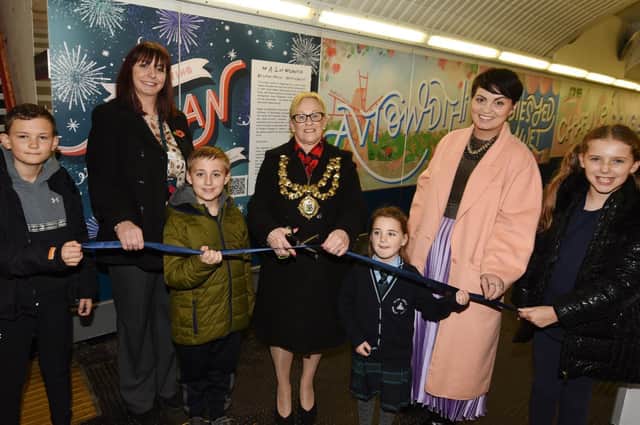 The official celebration of the new mural along the tunnel at Wigan North Western station, as local artist Jessica Riley worked with members of the community and school children to produce an A-Z of Wiganese.