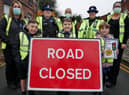 Police, school staff and pupils outside St Peter's