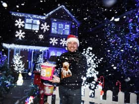 Mike Denaro outside his festive home