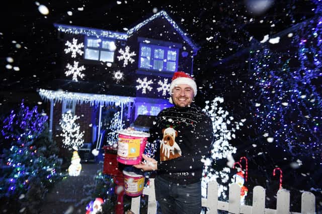 Mike Denaro outside his festive home