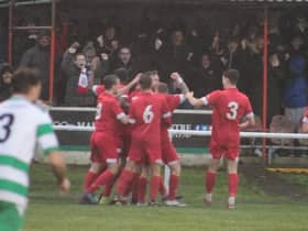The bumper crowd at Ashton Town celebrate the late winning goal