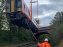 One of the stricken carriages is lifted off the tracks by an Ainscough crane