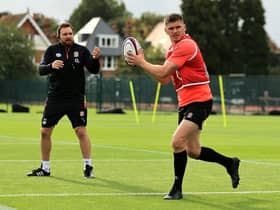 Martin Gleeson keeps a watchful eye on fellow Wiganer Owen Farrell