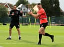 Martin Gleeson keeps a watchful eye on fellow Wiganer Owen Farrell