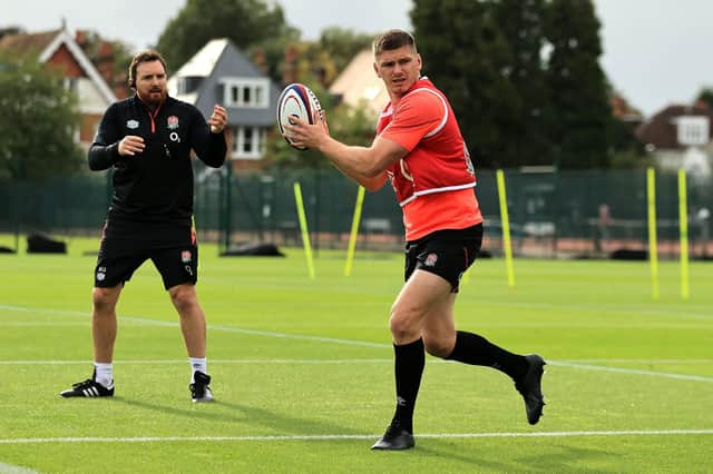 Martin Gleeson keeps a watchful eye on fellow Wiganer Owen Farrell