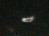 The saucer-shaped object hovering in the air