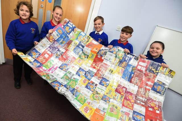 Members of the eco-team with the survival blanket