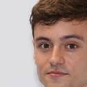 Tom Daley, who has backed a "world first" trial assessing a cannabis-based drug to treat an aggressive form of brain cancer, is to go ahead, a charity has announced.