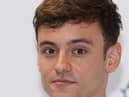 Tom Daley, who has backed a "world first" trial assessing a cannabis-based drug to treat an aggressive form of brain cancer, is to go ahead, a charity has announced.