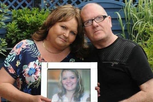 Trevor and Sheila Fairhurst with a picture of Carly