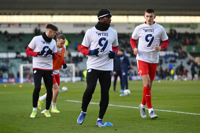 The Latics players showed their support for Charlie Wyke at Plymouth last weekend