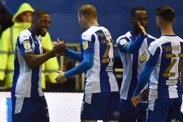 Tendayi Darikwa celebrates opening the scoring for Latics against Shrewsbury